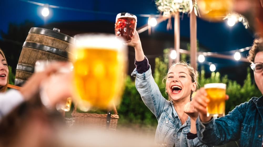 Friends sharing a pint of beer at local Nashville Breweries