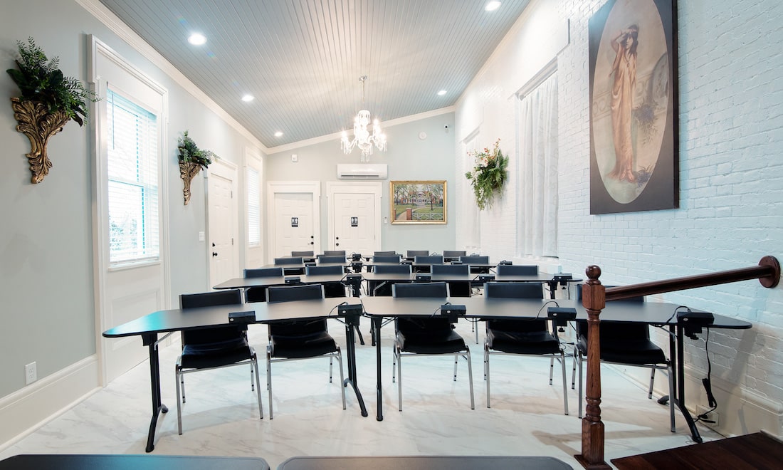 Nashville Meeting Space, a photo of a training room set up for a business session with tables and chairs 