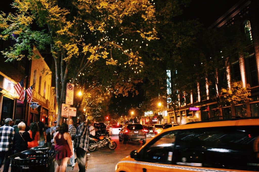 Explore the best hop on and hop off trolley tour in Nashville, photo of a night time street in Nashville