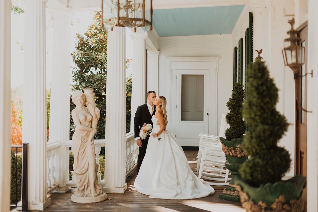 A couple posing for wedding photos at our Mansion Wedding Venue in TN