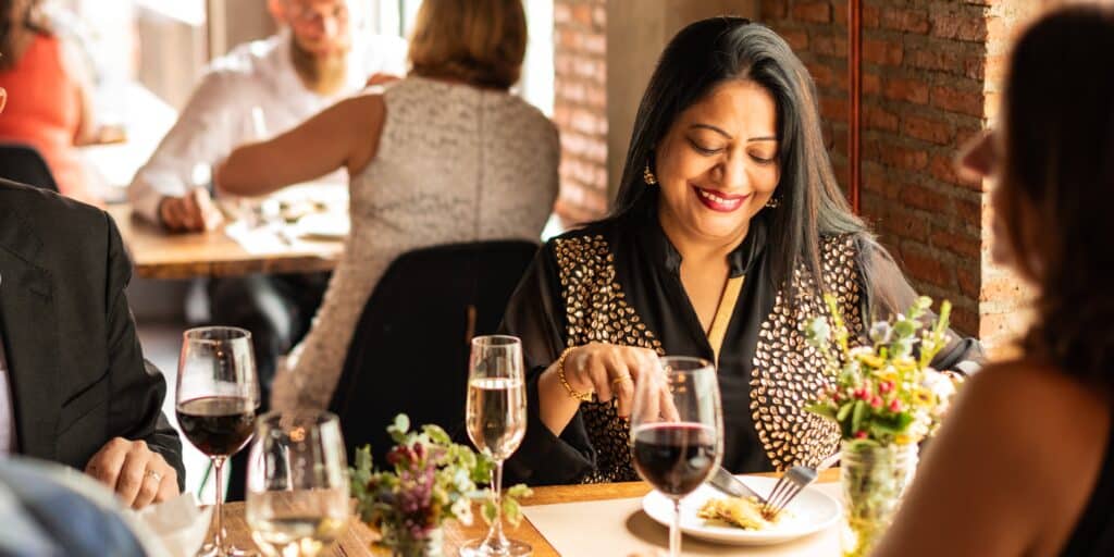 Book these Michelin Star Restaurants in Nashville for fine dining at its best. Group of friends enjoying a meal